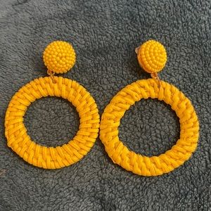 Woven around circles and beaded at top